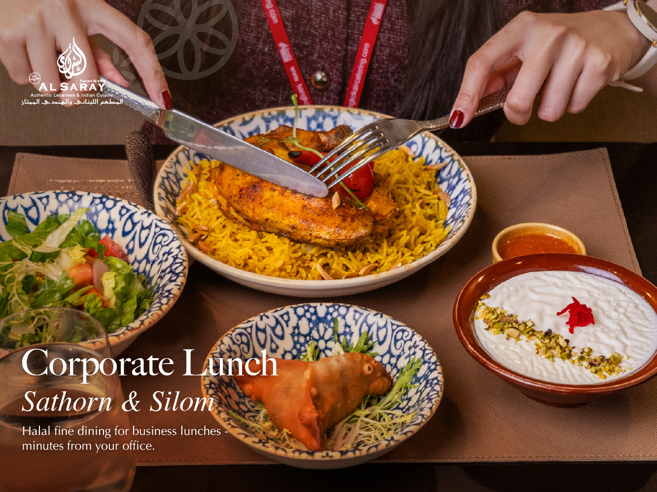 Corporate lunch at Al Saray — halal biryani, salad, samosa and dessert on a set tray