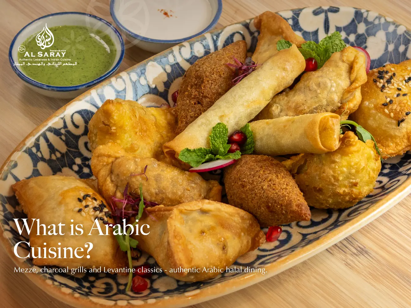 A platter of fried Arabic mezze at Al Saray in Bangkok: kibbeh, pastries and crispy rolls with mint and pomegranate, served with two dips