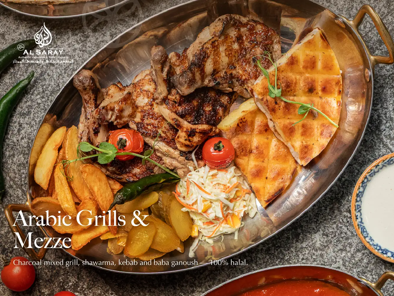 Grilled chicken with fries, pickles, coleslaw and grilled bread in a copper dish at Al Saray, a halal restaurant in Bangkok